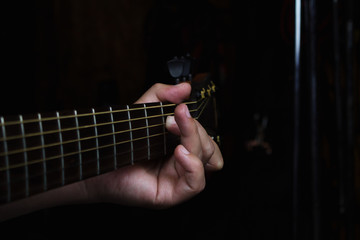 Acoustic Guitar Player Performing. Guitarist Playing In Music Studio