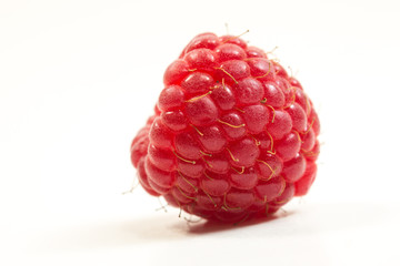 Close up of fresh raspberry on the white