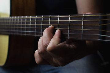 Acoustic Guitar Player Performing. Guitarist Playing In Music Studio