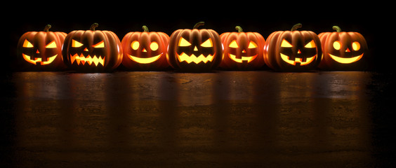Seven Halloween Pumpkin glowing faces in a row isolated on black background. 3D Rendering illustration