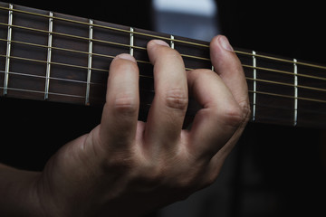 Acoustic Guitar Player Performing. Guitarist Playing In Music Studio