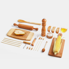 Composition of wooden cutting boards and wooden utensils and kitchen utensils. Top view.