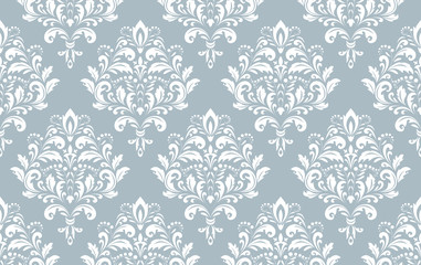 Wallpaper in the style of Baroque. Seamless vector background. White and blue floral ornament. Graphic pattern for fabric, wallpaper, packaging. Ornate Damask flower ornament