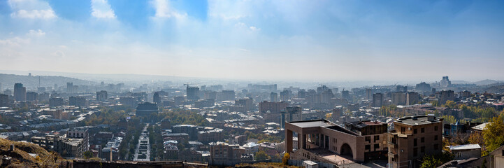 Naklejka na ściany i meble view of the city of Yerevan from the observation deck on a sunny day with clouds in the sky.
