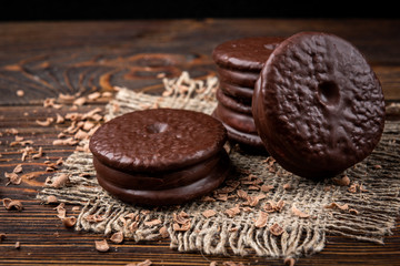 Chocolate cookies on dark wooden background. Chocolate pie.