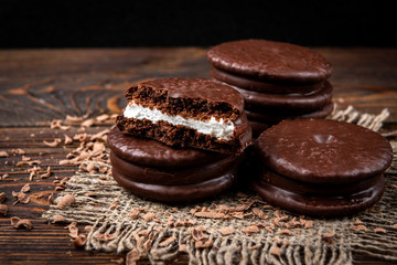 Chocolate cookies on dark wooden background. Chocolate pie.