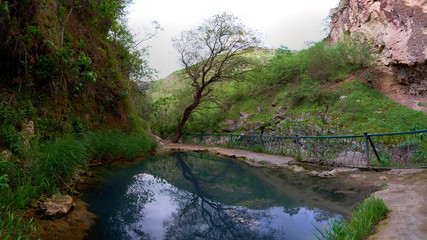 Mountain lake with warm mineral water, located in the gorge.