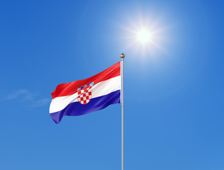 3D illustration. Colored waving flag of Croatia on sunny blue sky background.