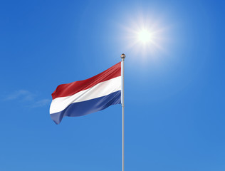 3D illustration. Colored waving flag of Netherlands on sunny blue sky background.