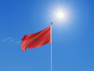 3D illustration. Colored waving flag of Morocco on sunny blue sky background.