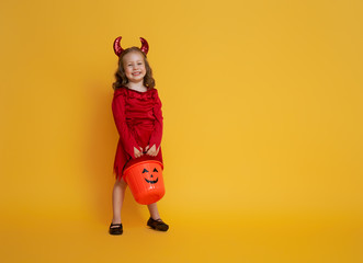 little devil with a pumpkin
