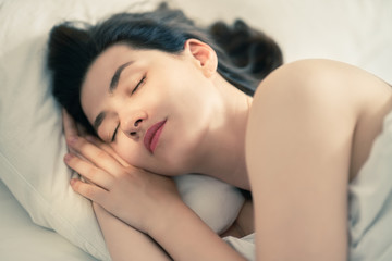 Obraz na płótnie Canvas young woman is sleeping