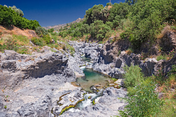 Fototapeta na wymiar Panoramic view from above of the spectacular Alcantara gorges, in Sicily Italy.