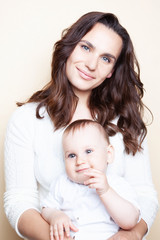 Portrait of small cute baby with mother