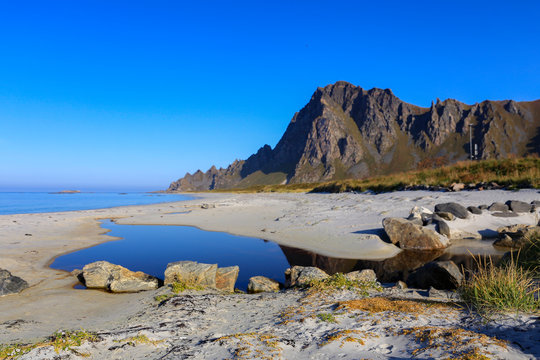 Sandy beach and mountains on Andenes Island Northern Norway