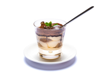 Classic tiramisu dessert in a glass cup on the plate on white background with clipping path
