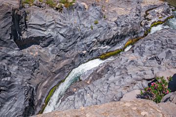 Cascades among the rocks, in the spectacular Alcantara gorges, in Sicily Italy.