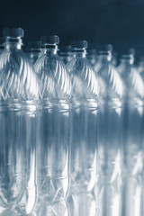 empty plastic bottles on dark background