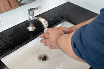 Man washing hand with water. healthy cleaning body care lifestyle concept.