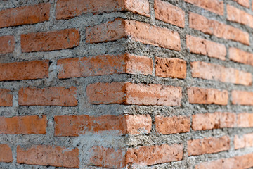Red corner brick wall architecture design pattern for exterior. Abstract background vuilding angle perspective structure surface texture.