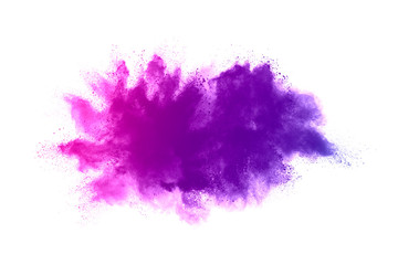 Freeze motion of purple color powder exploding on white background.