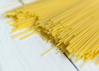 italian spaghetti on wooden background. Top view