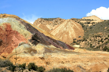 MULTICOLOR LANDSCAPE UNDER THE BLUE SKY