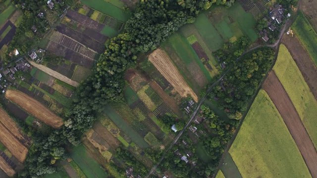 aerial top view of fields in countryside during cloudy day