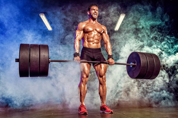 Strong Muscular Men Performing Heavy Deadlift Exercise With Barbells
