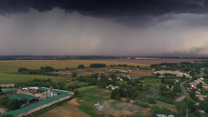Aerial drone hyperlapse before thunderstorm. The beginning of a storm, clouds are moving fast