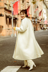 Asian girl in white coat