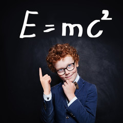 Successful young boy learning science