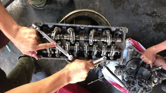 Hands on Car Engine Block petrol gasoline cylinder cam shaft spring rocker arm valve Repair refurbish
