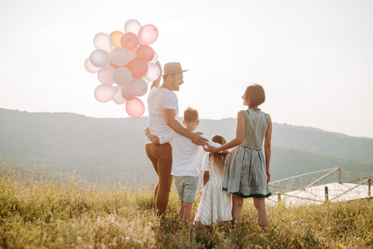 Happy family in nature. Happy family: mother, father, children son and daughter. life is made of little things.
