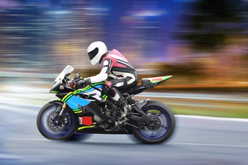 Fototapeta na wymiar Racing bike rider on a sports motorcycle on race track