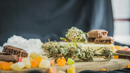 Preparing to cooking cake with cannabis butter. Concept of using marijuana in food industry.