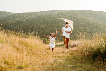 Father and daughter have fun in nature