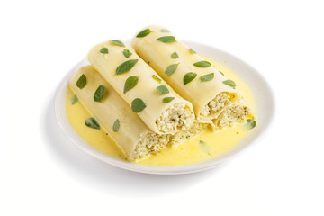 Cannelloni pasta with egg sauce, cream cheese and oregano leaves isolated on white background. side view