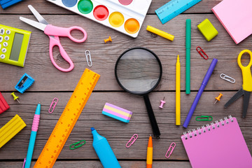 Back to school concept on grey wooden background, top view