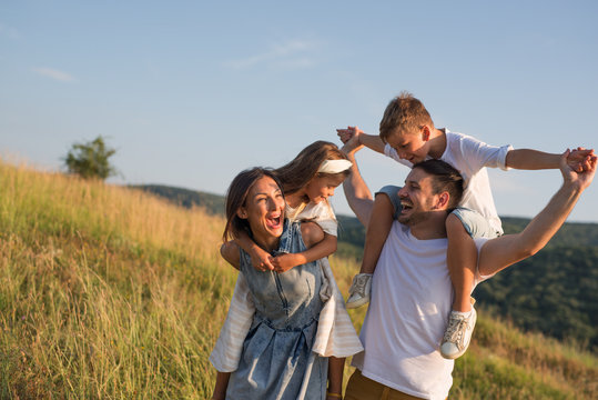 Happy family in nature. Happy family: mother, father, children son and daughter. life is made of little things.