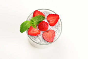 Chia pudding with strawberry and mint on a white background. Space for text or design.