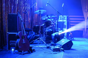 Guitar and other musical equipment on stage before concert