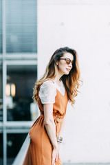  stylish image in the modern architecture of the building. a bright young girl in Berlin.