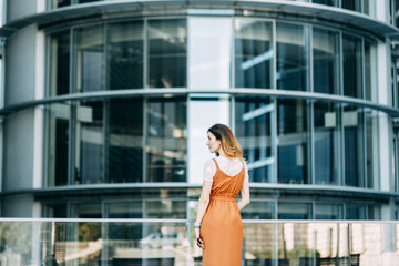  stylish image in the modern architecture of the building. a bright young girl in Berlin.