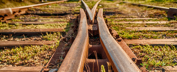 Old rusty railway sleepers and rails close-up