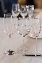 empty glasses for different drinks on the table
