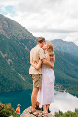 Naklejka premium Lovely couple traveling together in mountains in High Tary national park in Poland, UNESCO world heritage