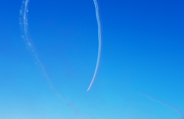 Aerobatic team performing on the event, blue sky background