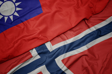 waving colorful flag of norway and national flag of taiwan.