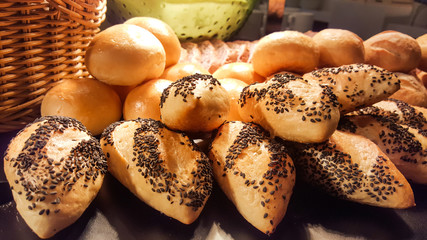 Fresh fragrant bread with black sesame on the table. a traditional breakfast food concept